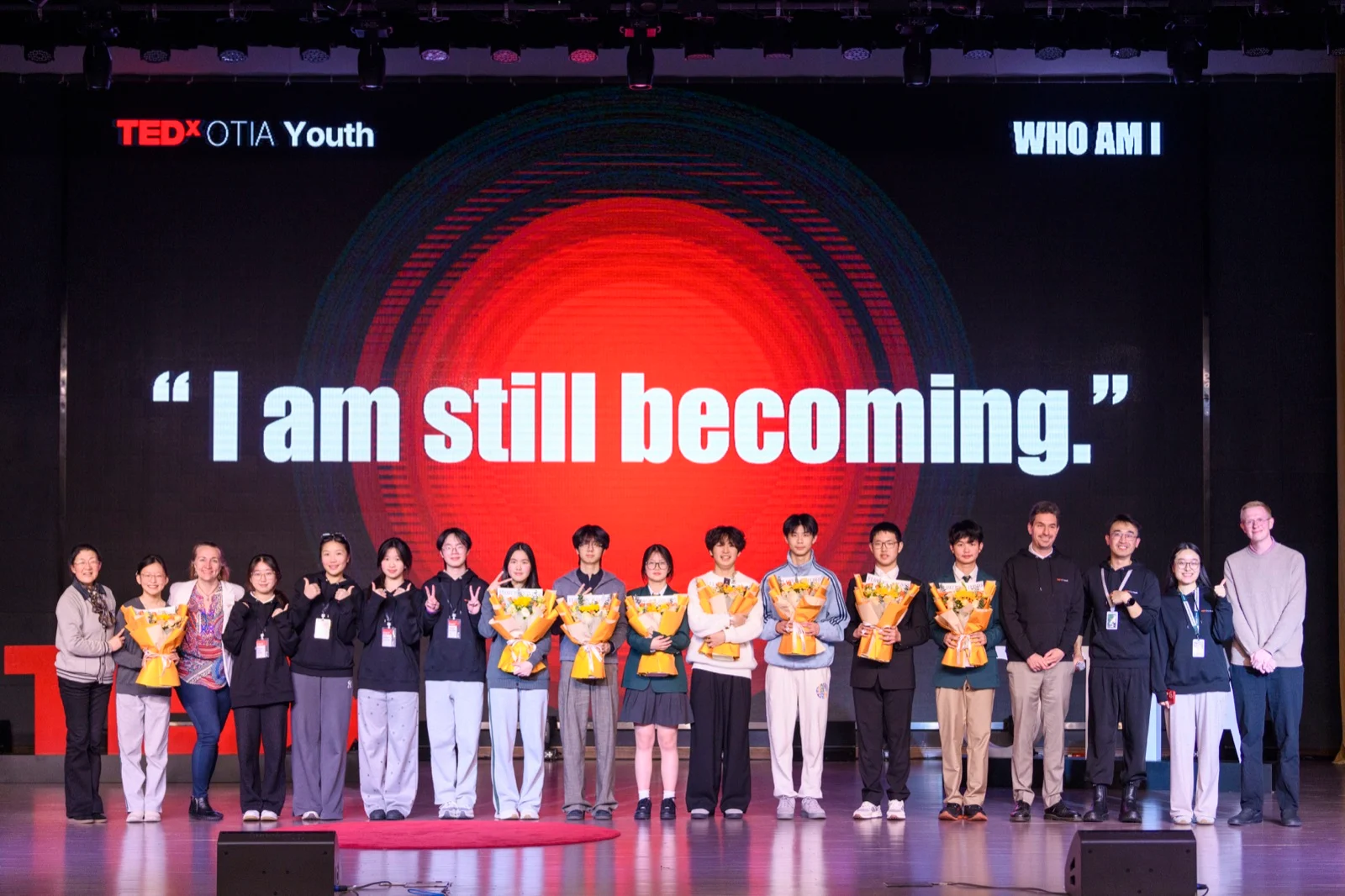 The TEDxOTIA Youth speakers and team on stage after the event